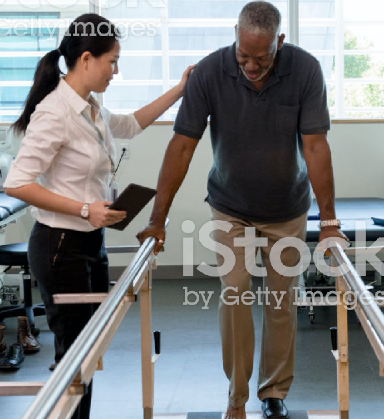 Employee walks with a Female Elderly Patient